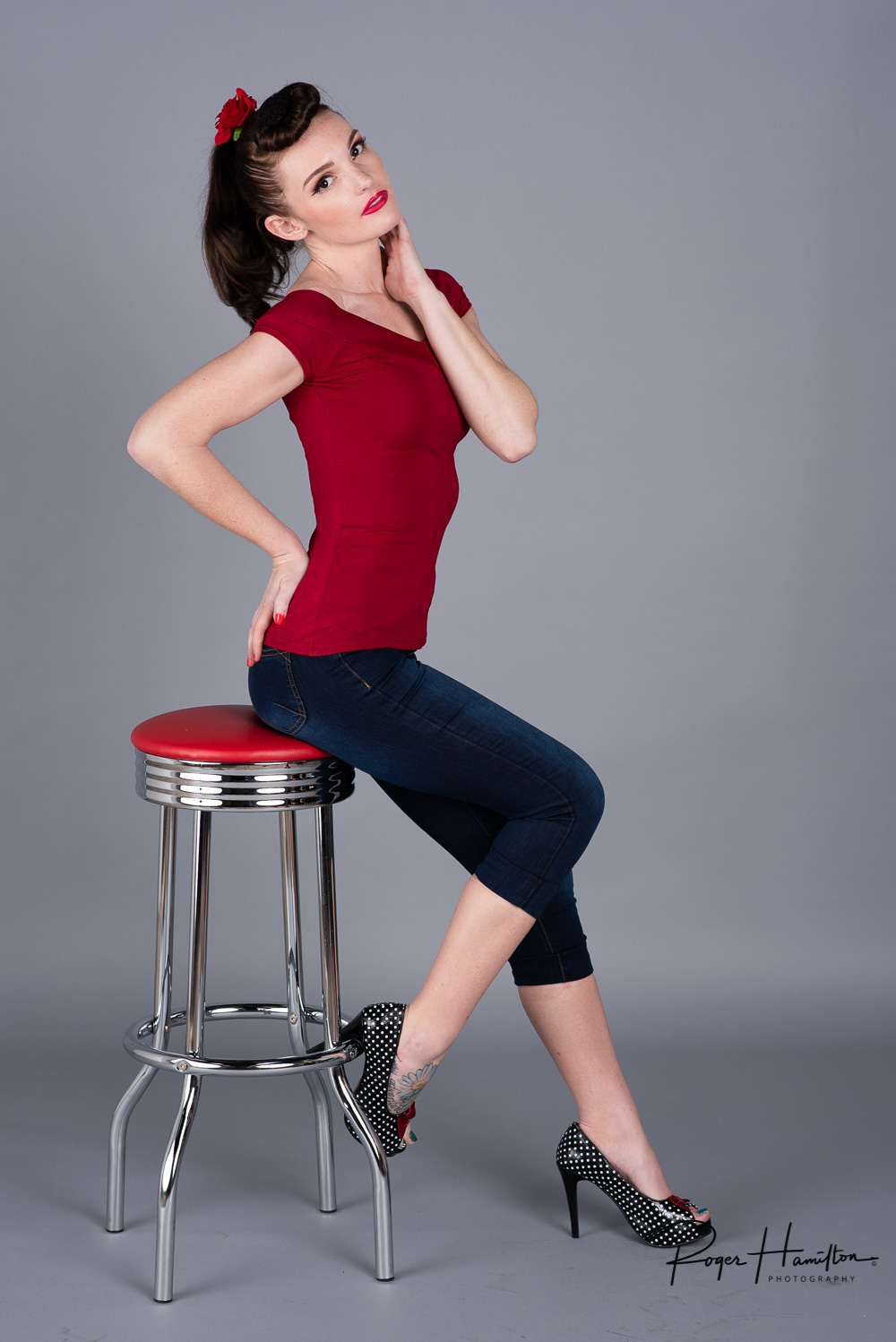 Calysta posing on a 50s inspired bar stool