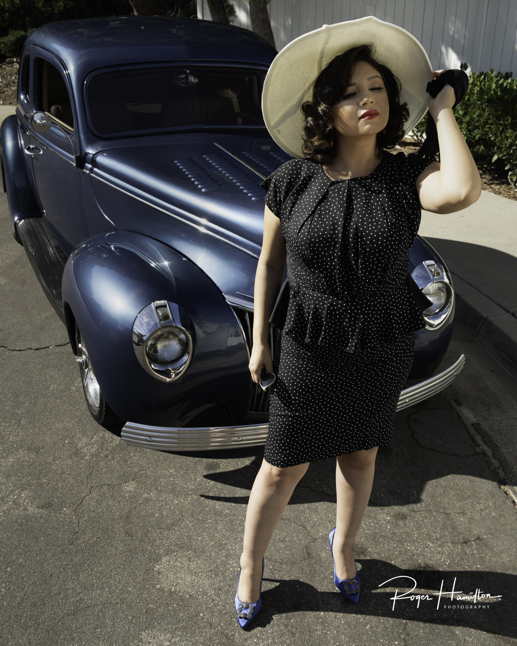 Patricia rocking the 1940s look in front of a vintage car